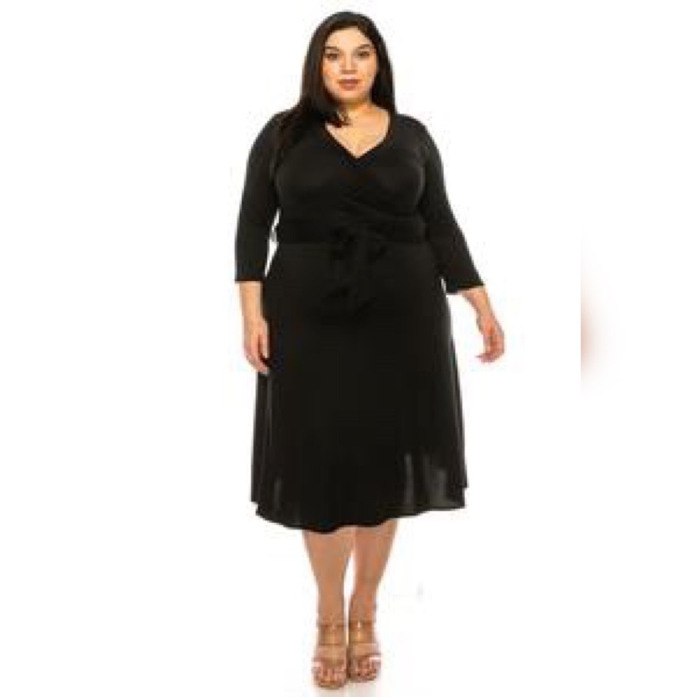 Plus size, solid faux wrap dress with deep V-neck and waist tie.